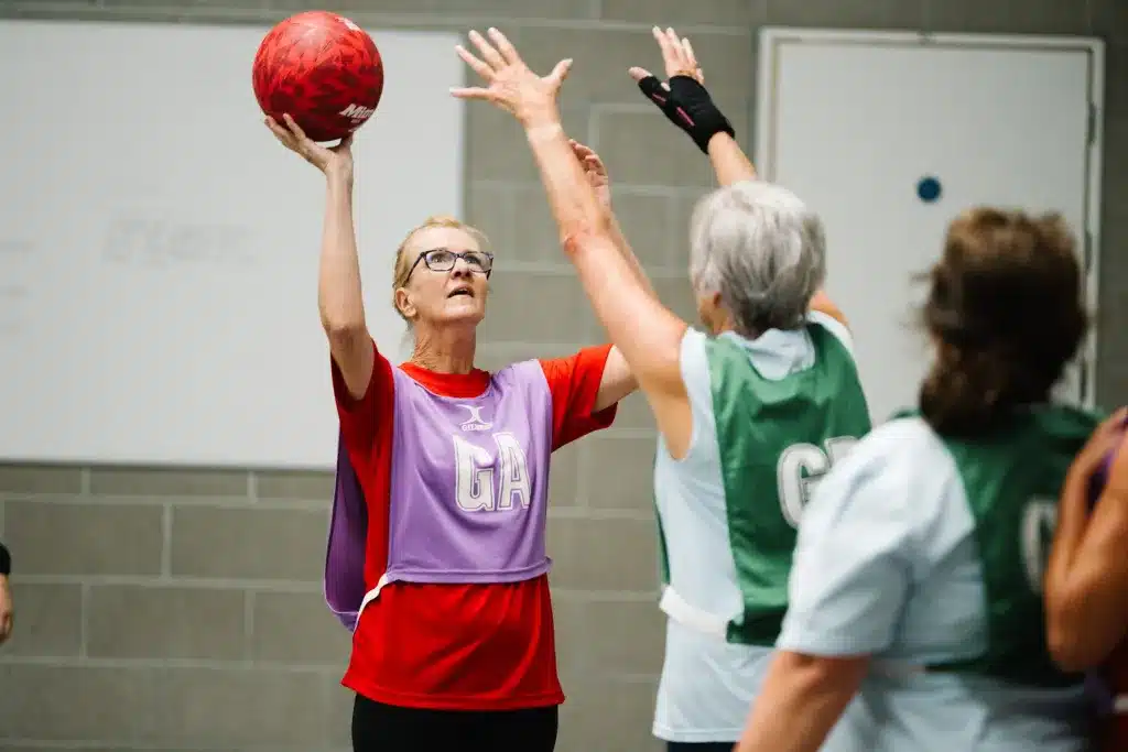 Walking netball is a version of netball that is adapted to be a slower game, thus breaking down barriers and allowing more to play. The main differences in the rules are that running and jumping aren’t allowed, that an extra step may be taken with the ball if in motion and that the ball may be held for four seconds, instead of the usual three. A walking-netball programme was first developed in England in 2017 through a collaboration between England Netball and the charity Age UK.